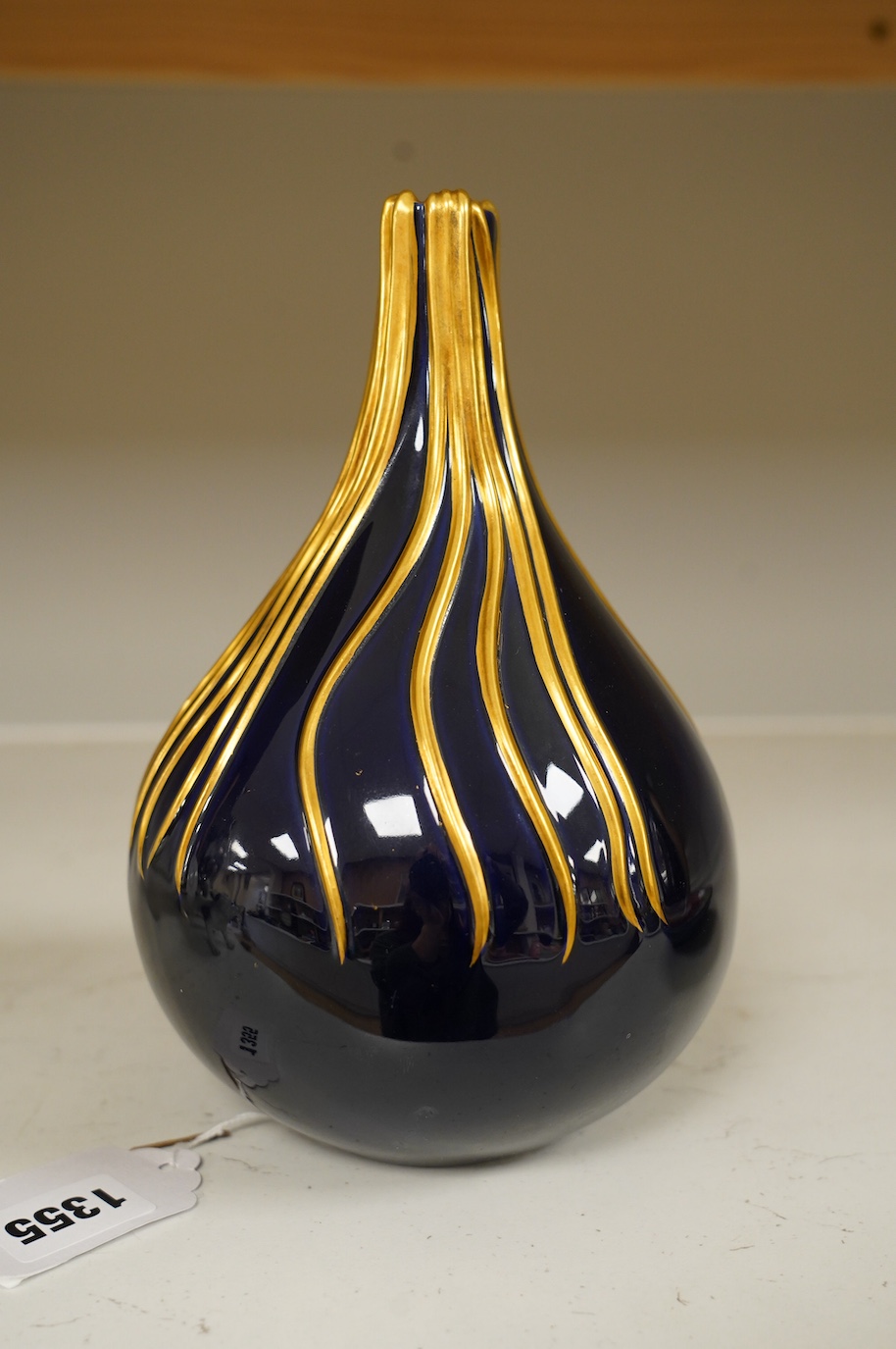 Richard Ginori cobalt blue and gilt bottle vase, mid century, designed by Giovanni Gariboldi, with raised streams of gold running down from the top, numbered 1913E, 21.5cm high. Condition - good